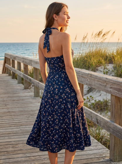 Navy floral halter wedding guest midi dress by Riley Belle