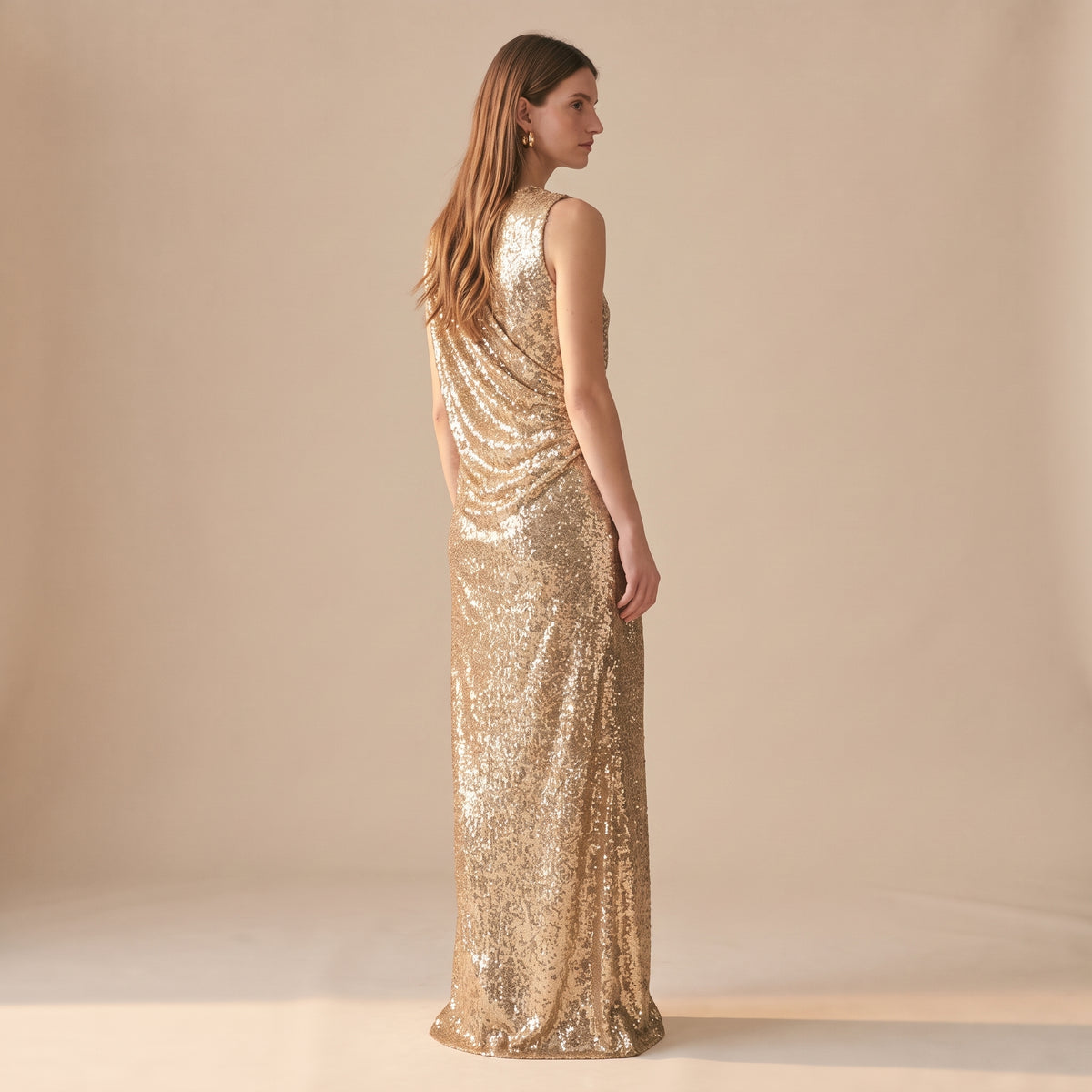 Celia gold sequin maxi dress side view by Riley Belle