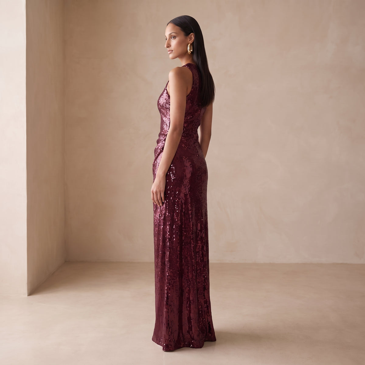 Ruby wine sequin maxi dress side view by Riley Belle