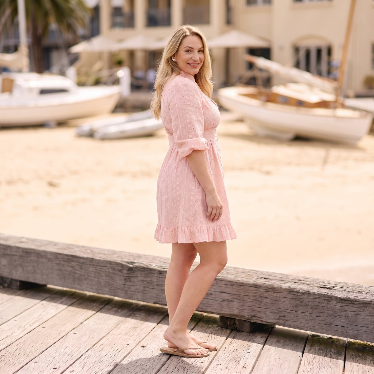 Rosie pink broderie mini dress side view by Riley Belle