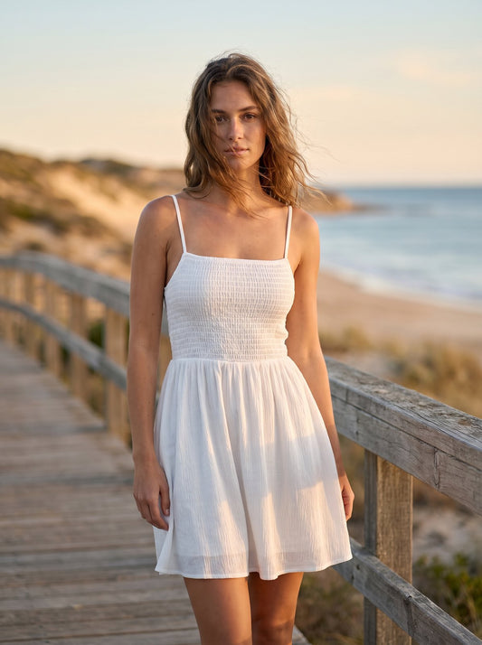 White shirred summer mini dress by Riley Belle