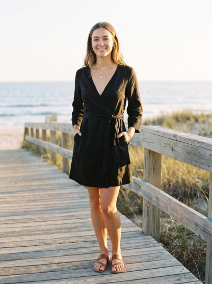 Black wrap mini dress by Riley Belle